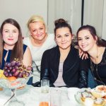 Opiekun Koła mgr Marta Falińska i trzy studentki przy stole